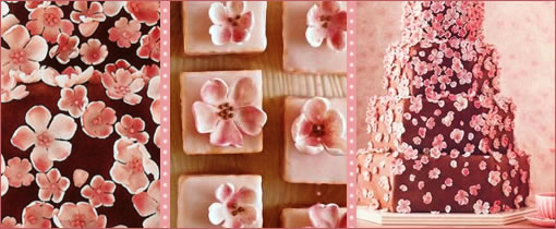Elegant cake, cookies, and fabric with pink cherry blossoms