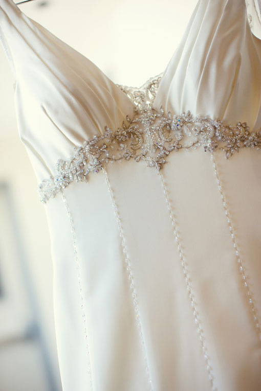 Elegant white wedding dress with beaded embellishments