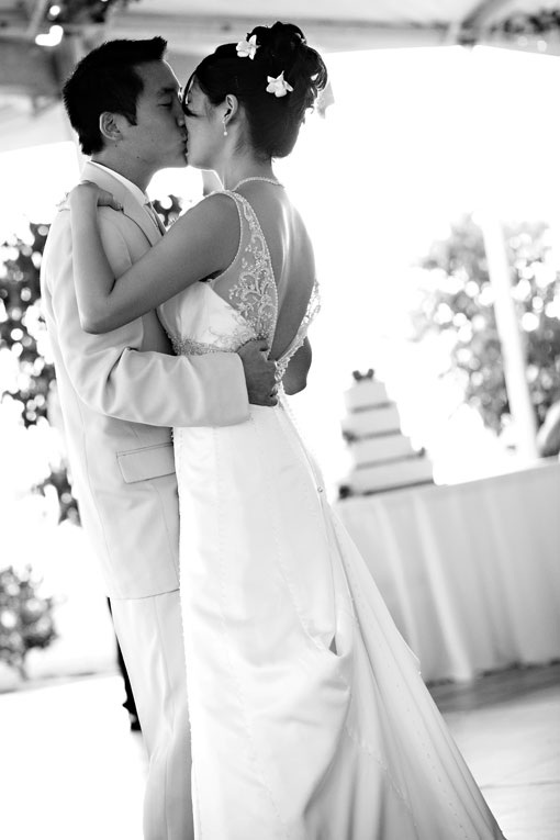 Bride and groom share a kiss on wedding day