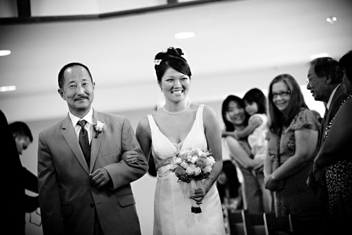Black and white image of bride and father at wedding
