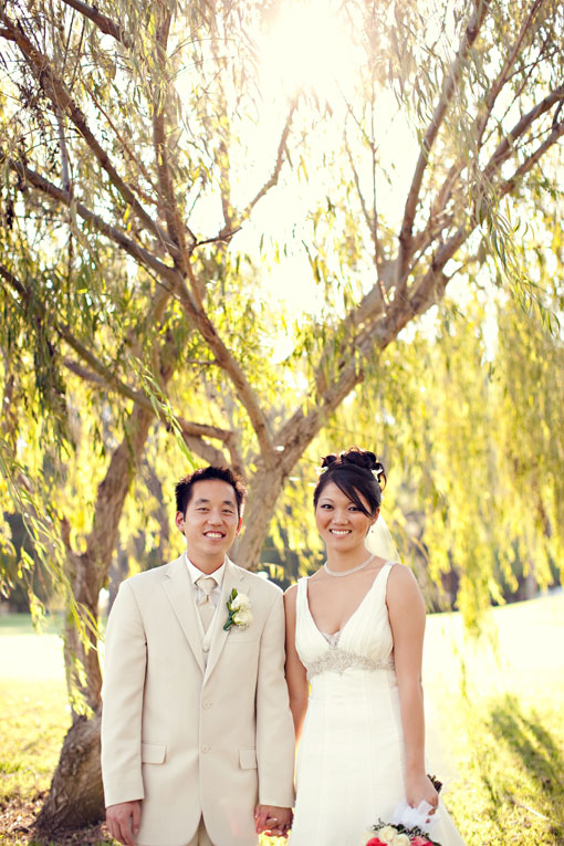 Happy Asian couple on their wedding day outdoor