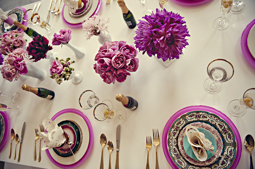 Elegant table setting with pink flowers and champagne