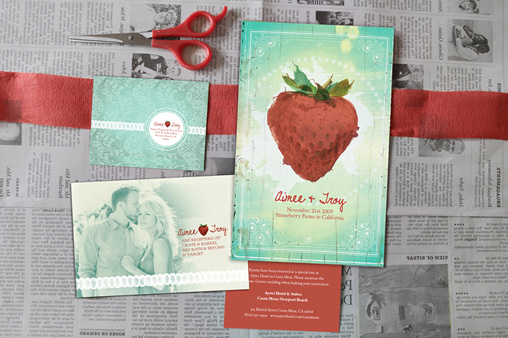 Wedding invitations with a strawberry theme and a red ribbon