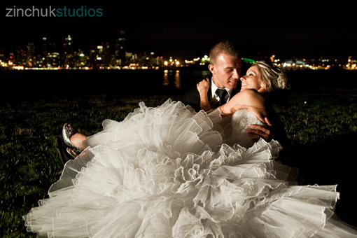 Romantic wedding couple with city skyline at night