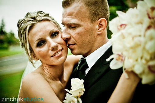 Happy bride and groom embrace on their wedding day