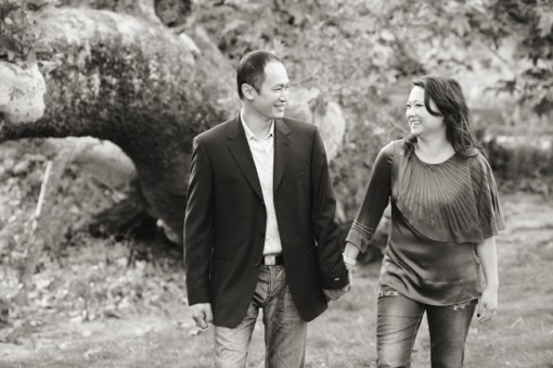 Smiling couple holding hands in a beautiful outdoor setting