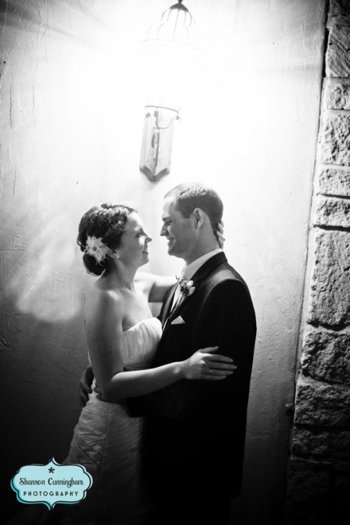 Romantic newlywed couple embracing in wedding portrait