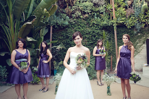 Bride and bridesmaids in a beautiful garden wedding setting