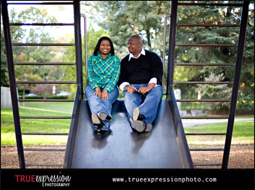 engagement photo of couple at a playground