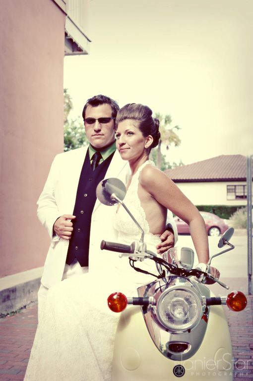 Stylish bride and groom on a vintage scooter, wedding day
