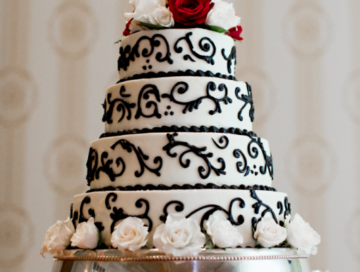Elegant four tier wedding cake with floral accents