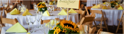 Elegant wedding reception table setting with sunflowers