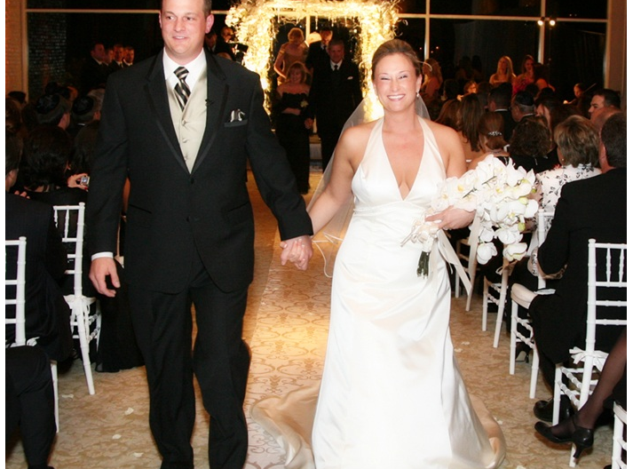 Bride and Groom walk down the aisle at wedding ceremony