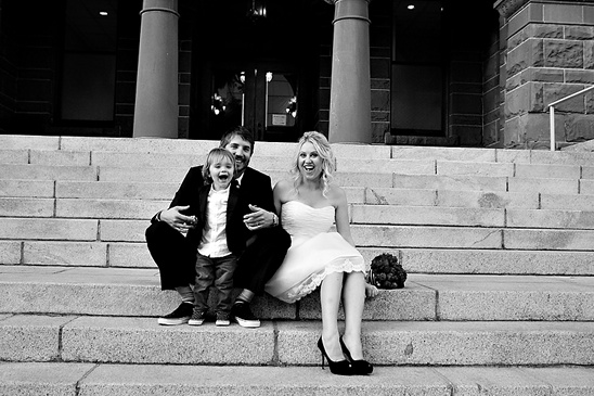 Happy family wedding portrait on the stone stairs