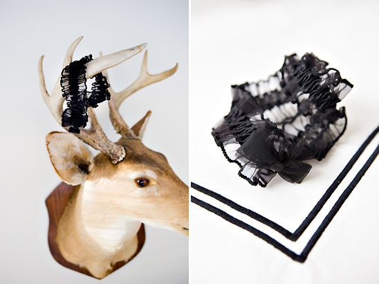 Black garter on deer antlers and on white fabric