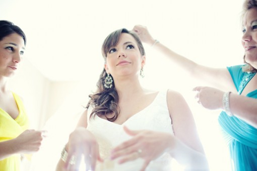 Bride and bridesmaids on her wedding day getting ready