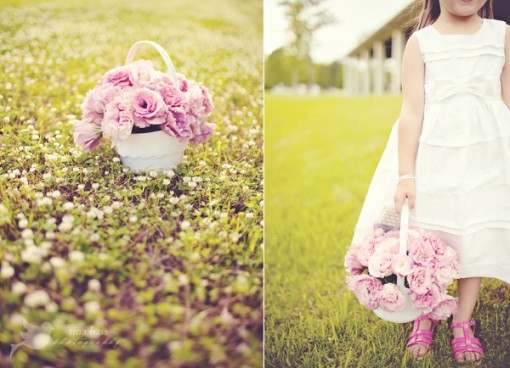 Flower girl carries pink roses in a white basket outdoors