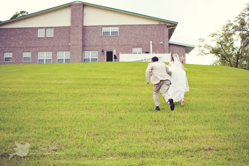 Bride and groom run away happily after wedding ceremony