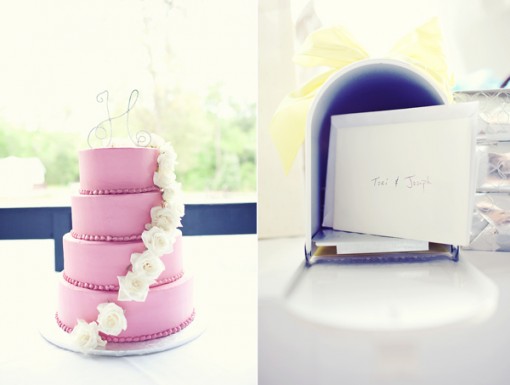 Pink wedding cake with floral accents next to mailbox with card
