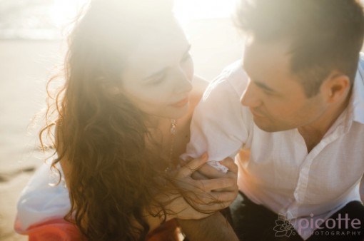 a breathtaking beach and city engagement . picotte photography