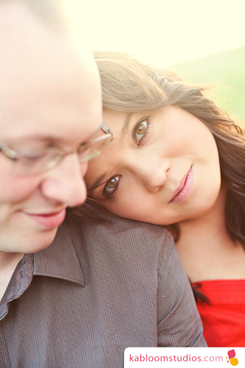 Lovely couple gazing at each other, intimate portrait in the sunlight