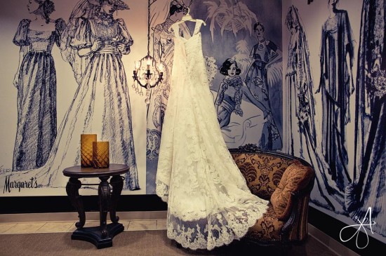 Elegant lace wedding gown on vintage backdrop