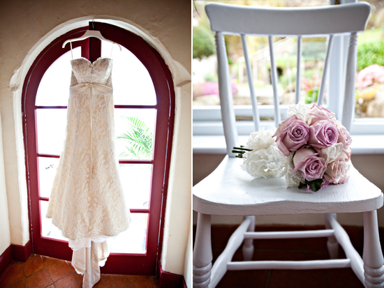 Wedding dress hanging near a chair with bouquet of roses
