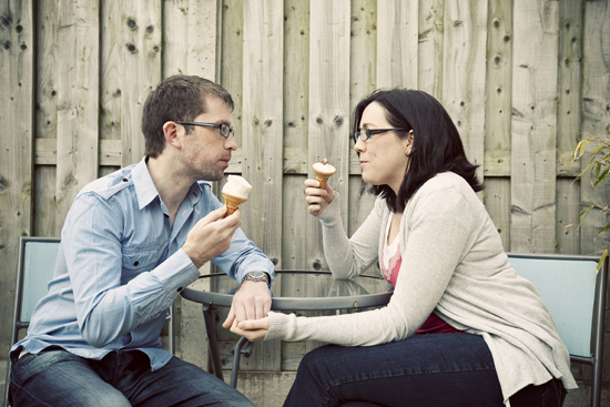 Couple enjoying ice cream cones together on a sunny day