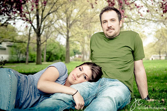 Couple relaxing in the park on a sunny day with trees