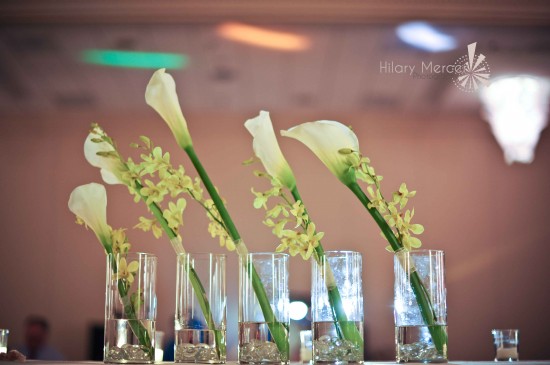 Elegant floral centerpieces with calla lilies in glass vases