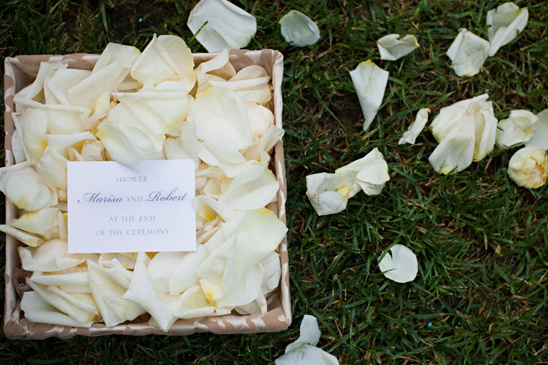 White rose petals in basket for a wedding shower