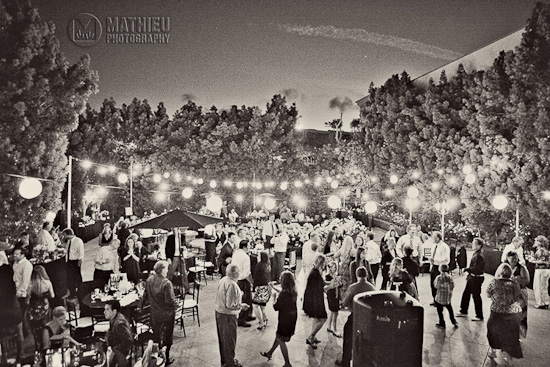 Wedding reception with guests dancing under the lights