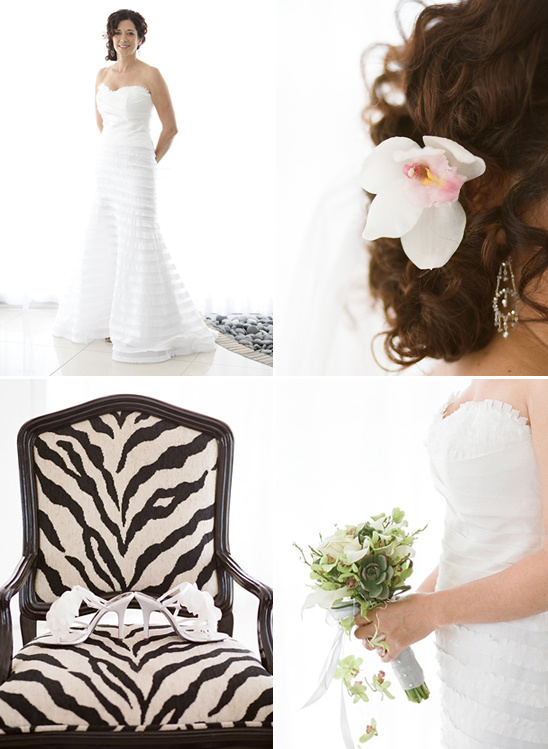 Bride poses on wedding day with flowers and zebra chair