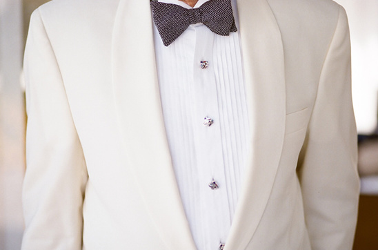 Elegant cream suit and bow tie close up, perfect for weddings
