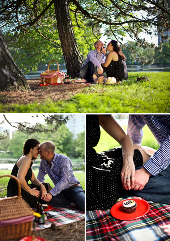 Couple enjoying picnic in park, eating cupcake and getting close