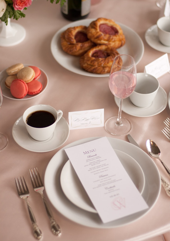 Elegant brunch table setting with pastries, coffee, and menu
