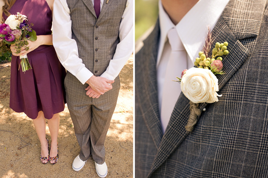 Groom's suit with boutonniere and bride holding bouquet