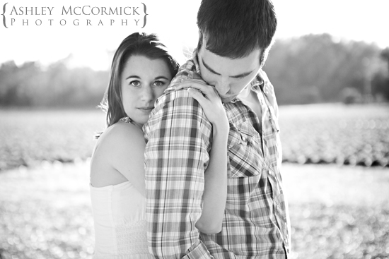 Loving couple embracing in a field, romantic black and white photo