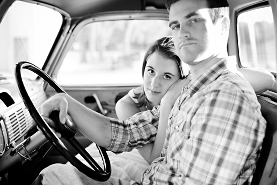 Couple in a vintage car, intimate moment with black and white filter