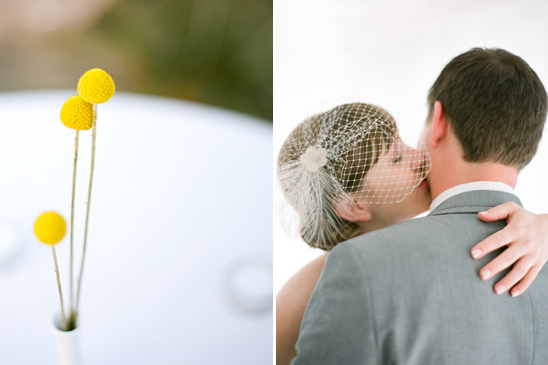 Yellow billy balls and a bride kissing her groom on the wedding day