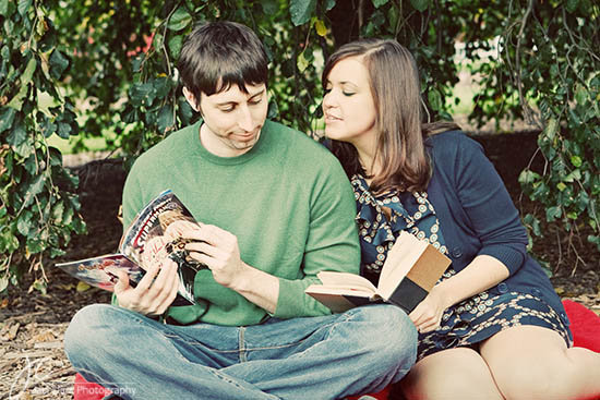 Couple enjoys reading outdoors together with a comic book and book