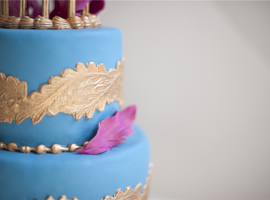 Pretty light blue cake with gold trim and purple accents