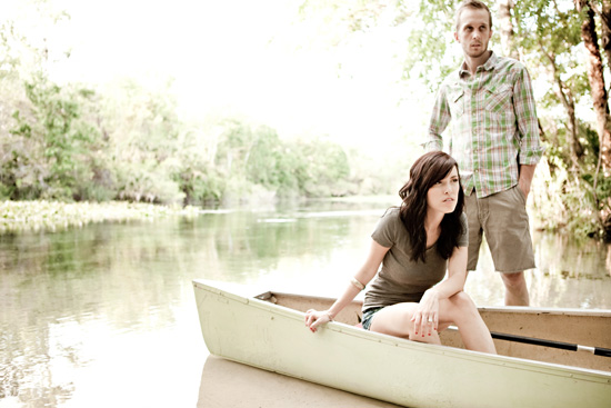 Couple in a canoe on a peaceful lake in a nature setting