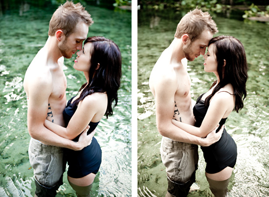 Couple standing in water, embracing and looking at each other