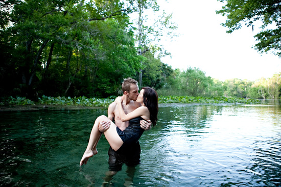 Romantic couple kissing in the water, nature background