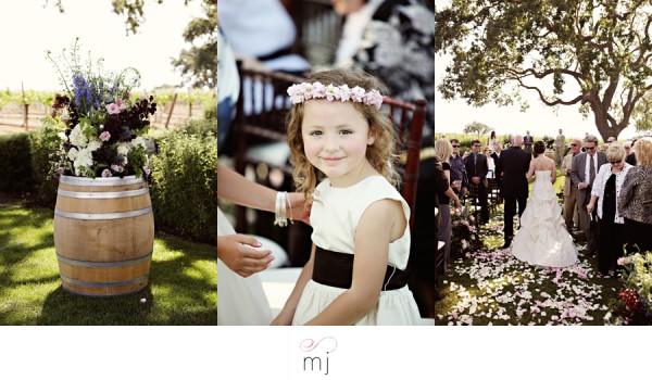 Wedding flower girl in white dress at vineyard ceremony