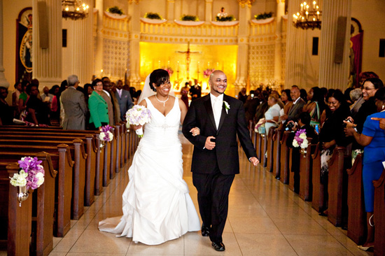 Happy couple walks down the aisle after their wedding ceremony
