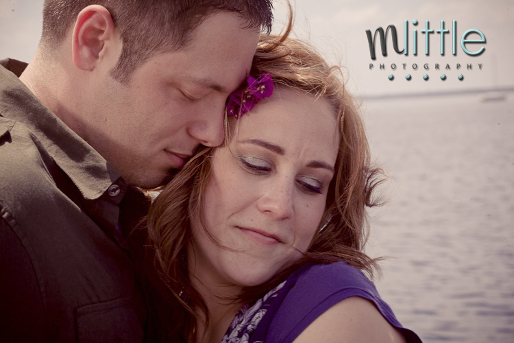Romantic couple embracing by the sea, mLittle Photography