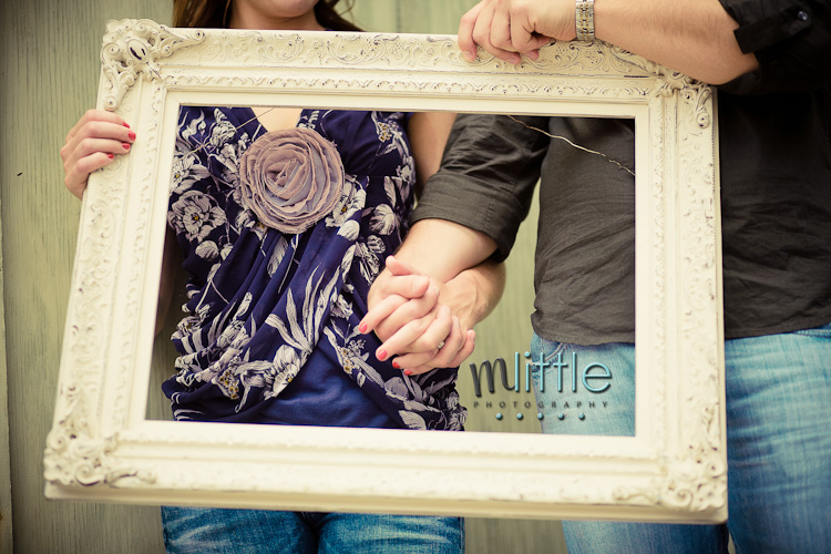 Couple holding hands in ornate frame