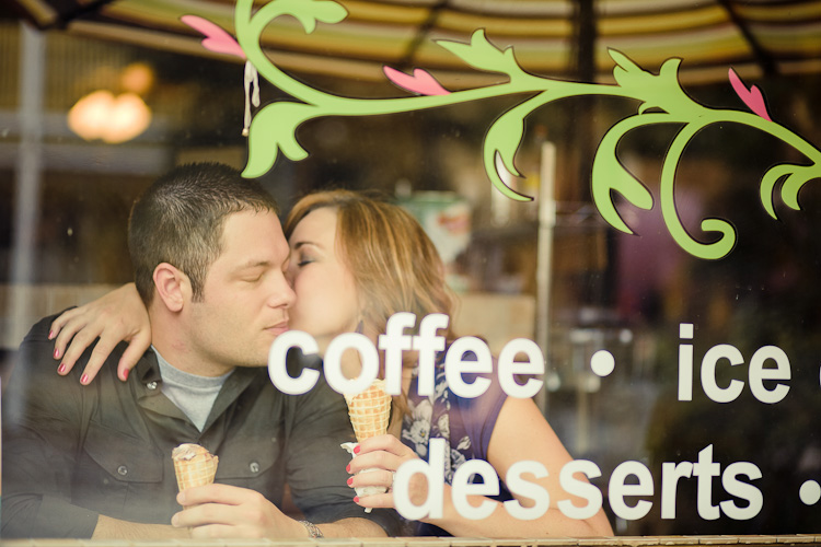 Couple kissing enjoying ice cream desserts
